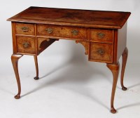 Lot 550 - An early 18th century and later walnut lowboy,...