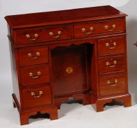 Lot 554 - A George II style mahogany kneehole desk,...