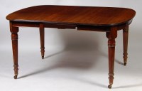 Lot 568 - A circa 1900 mahogany extending dining table,...