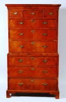 Lot 572 - A George II figured walnut chest-on-chest, the...