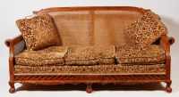 Lot 585 - A circa 1900 walnut three piece Bergere suite,...