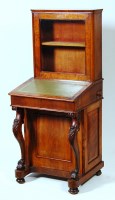 Lot 587 - A Victorian figured walnut davenport cabinet,...