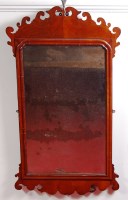 Lot 590 - A George III mahogany fret carved wall mirror,...