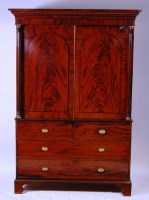 Lot 595 - A Regency mahogany linenpress, the upper...