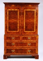 Lot 611 - A George II style figured walnut linenpress,...