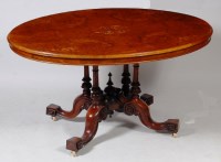 Lot 633 - A Victorian figured walnut pedestal breakfast...