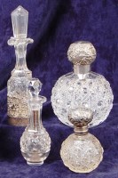 Lot 109 - A circa 1900 cut glass and silver topped scent...