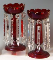 Lot 115 - A pair of Bohemian ruby glass pedestal lustres,...