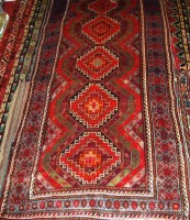 Lot 491 - A Kurdish woollen rug, the central ground...