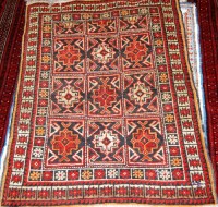 Lot 501 - A Kurdish woollen rug, decorated with three...