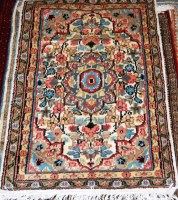 Lot 502 - A small Kashmir woollen rug, having a cream...