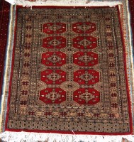 Lot 503 - A small Persian Bokhara woollen rug, having...