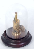 Lot 44 - A sweat small vertical steam engine of brass,...