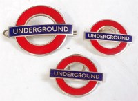 Lot 79 - Underground red roundel cap badge, and 2...