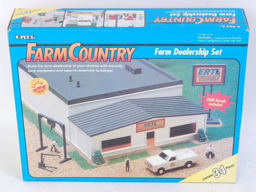 Lot 1259 - An ERTL Farm Country boxed set titled Farm...