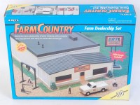Lot 1259 - An ERTL Farm Country boxed set titled Farm...