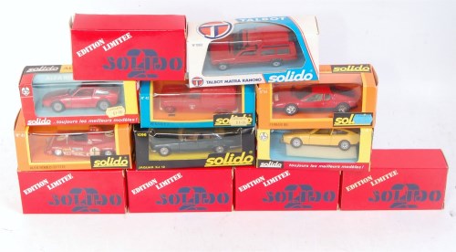 Lot 2597 - 12 various window box Solido diecast saloons...