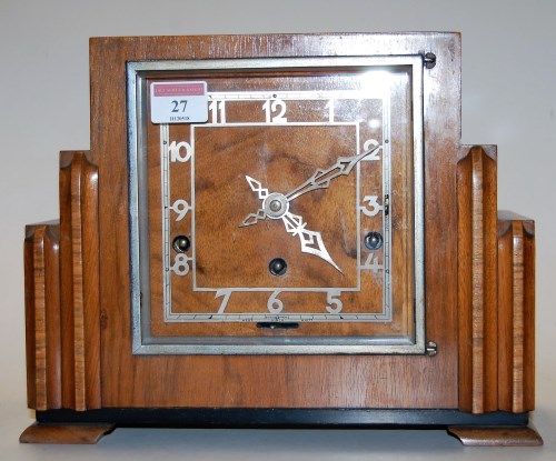 Lot 27 - An Art Deco walnut cased mantel clock having...