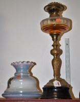 Lot 30 - A circa 1900 brass pedestal oil lamp having...