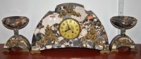 Lot 44 - An Art Deco marble and brass mounted clock...
