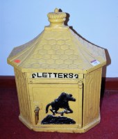 Lot 115 - A reproduction yellow painted cast iron letterbox