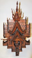Lot 116 - A large carved softwood model of a Tibetan...