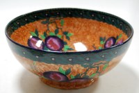 Lot 124 - A Maling lustre bowl on an orange ground...