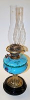Lot 146 - A late Victorian oil lamp having a blue glass...