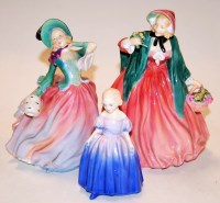 Lot 224 - Three Royal Doulton figurines, comprising;...