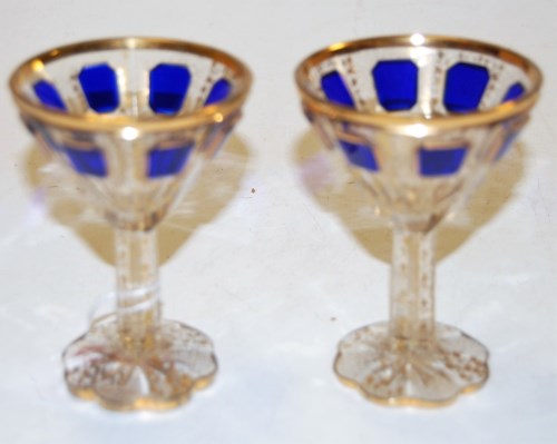 Lot 268 - A pair of Bohemian glass pedestal liqueurs,...