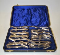 Lot 303 - A cased set of twelve silver plated sugar bows