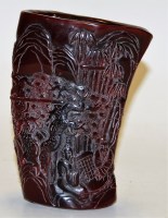 Lot 334 - A reproduction Chinese carved resin libation...