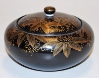 Lot 384 - A Japanese black lacquered jar and cover, of...