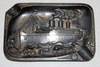 Lot 386 - An early 20th century pewter ashtray, relief...