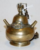 Lot 387 - An Oriental bronzed incense burner, with...