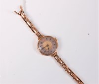 Lot 415 - A lady's 9ct wristwatch, the round two-tone...