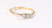 Lot 423 - A three stone diamond ring, total estimated...