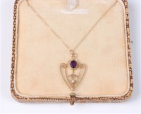 Lot 424 - An amethyst and faux pearl pendant, all in...