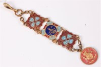 Lot 427 - A gilt metal and enamel decorative fob, 13cm long