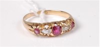 Lot 430 - An 18ct ruby and diamond ring, the three...