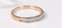 Lot 434 - A 9ct half hoop diamond ring, the small round...