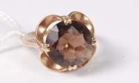 Lot 440 - A 9ct smokey quartz ring, the round smokey...