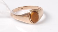 Lot 447 - A 9ct tigers eye ring, the oval tigers eye...