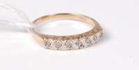 Lot 451 - A 9ct seven stone diamond ring, the small...