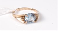 Lot 453 - A topaz single stone ring, the round topaz,...