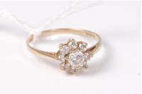 Lot 454 - A 9ct CZ cluster ring, the plain band with...