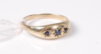 Lot 456 - A 9ct sapphire ring, the three gypsy set...