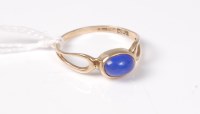 Lot 457 - A 9ct blue hardstone ring, the oval blue...