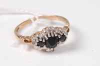 Lot 462 - A 9ct sapphire and diamond cluster ring, the...