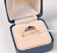 Lot 467 - A sapphire and diamond ring, the central...